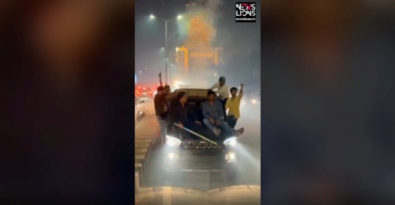 Youths burst firecrackers while sitting on top of car, punished by police in western India