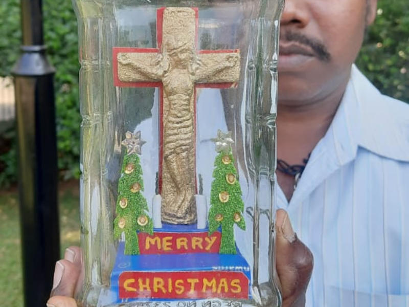 Miniature artist from eastern India creates statuette of Jesus Christ inside glass bottle ahead of Christmas day