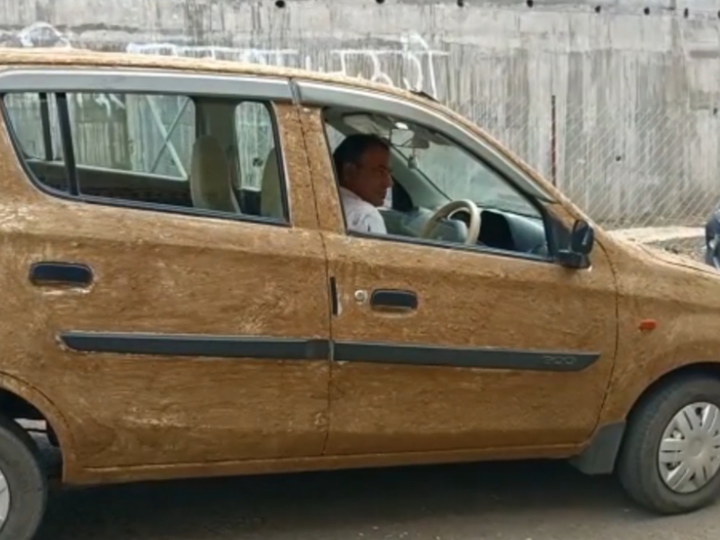 Doctor in central India coats car with cow dung to keep it cool