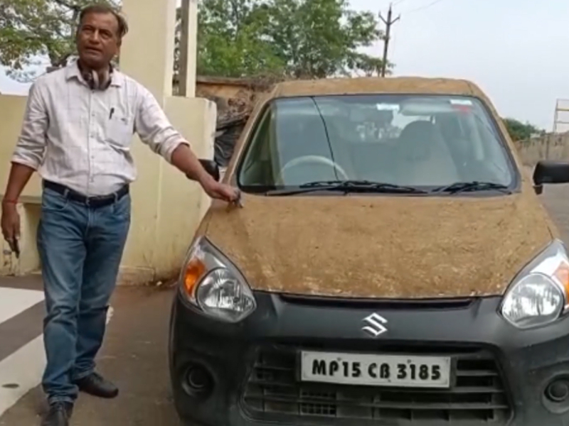 Doctor in central India coats car with cow dung to keep it cool