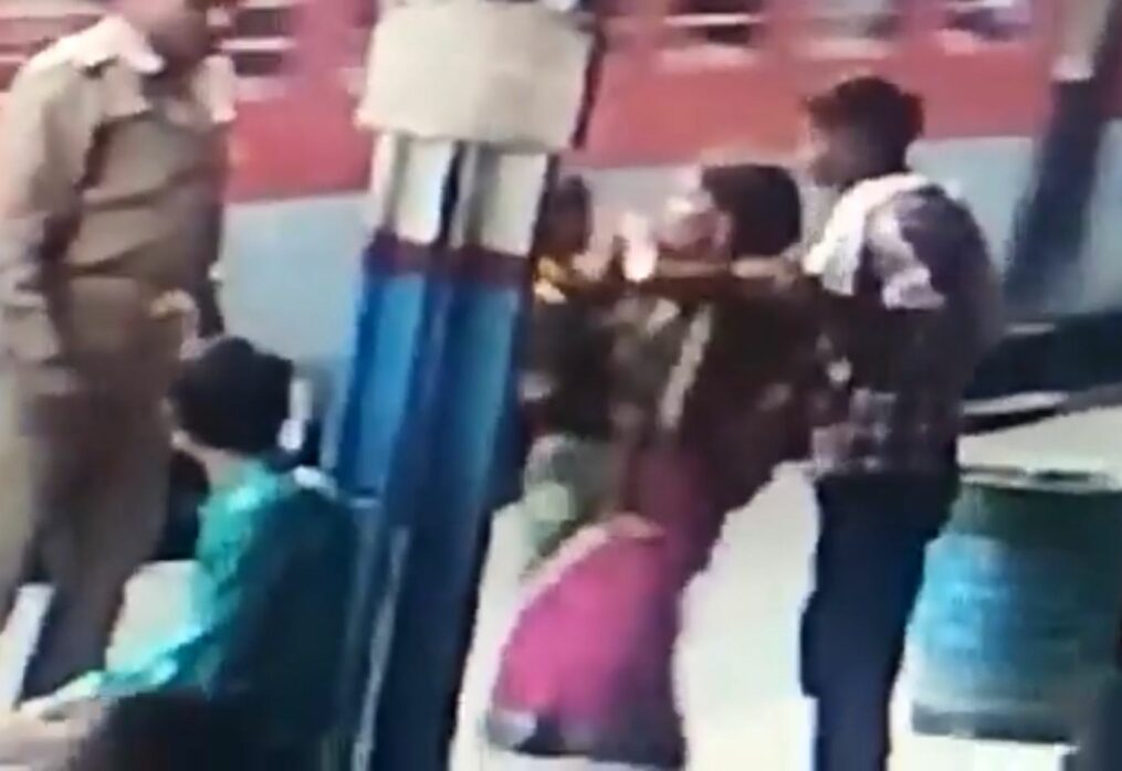 Female passenger slips while getting down moving train in northern India, cop comes to her rescue