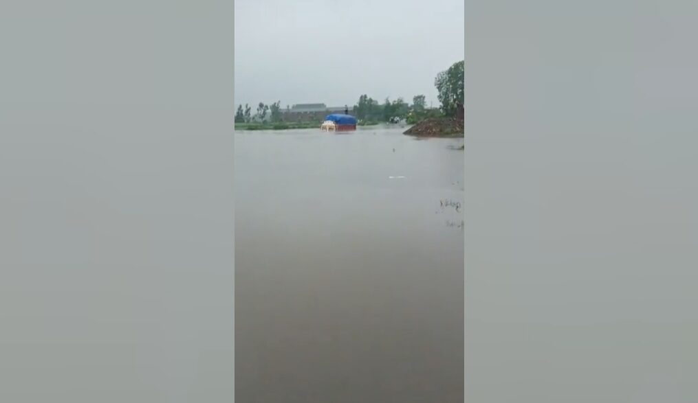 Truck with driver and helper rescued after rainfall leads to road being heavily-flooded in northern India