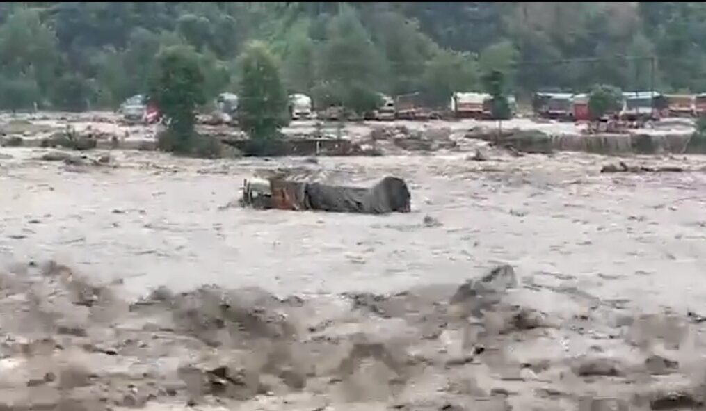Truck swept away like paper boat in flooded river in northern India