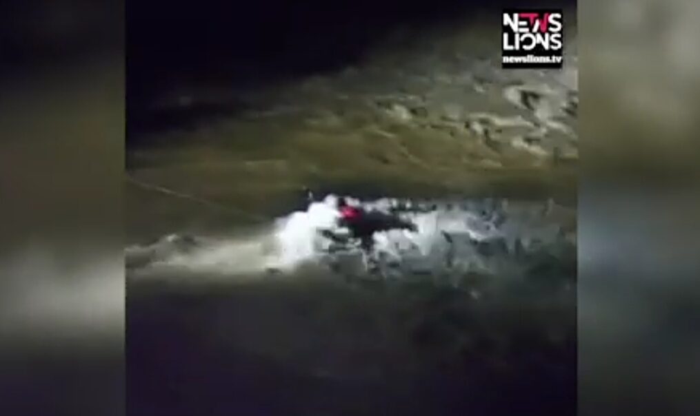 State rescue team officials save man stuck in river in northern India