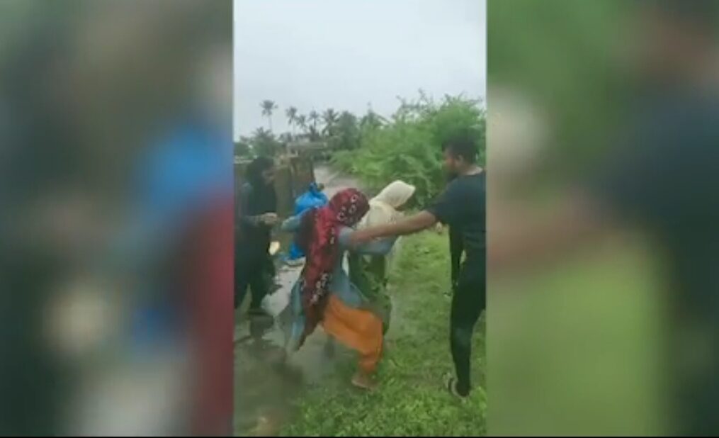 Rescue operation officials save locals stuck in flood-stricken area in western India