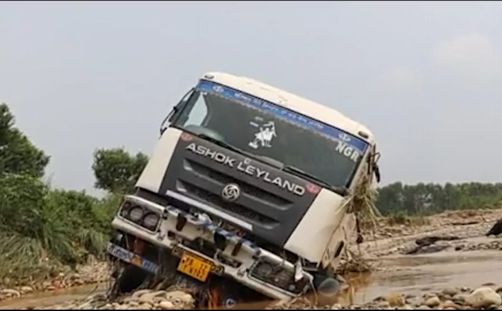 Container carrying cement gets stuck in flooded area in northern India