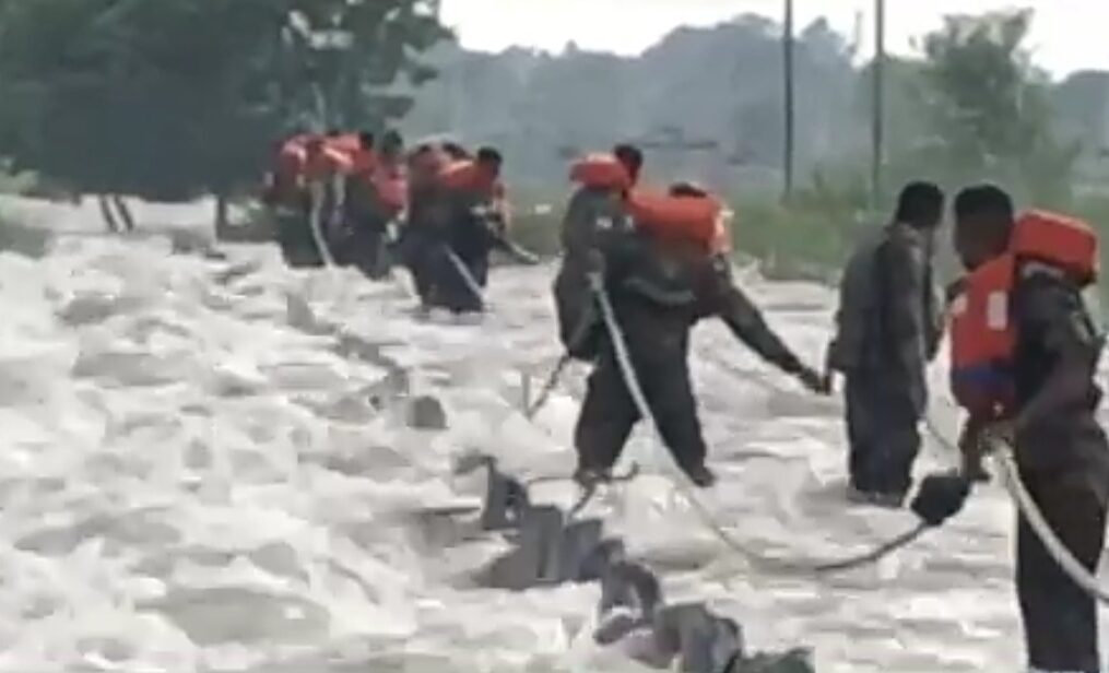 Heavy rain submerges bridge under water in northern India