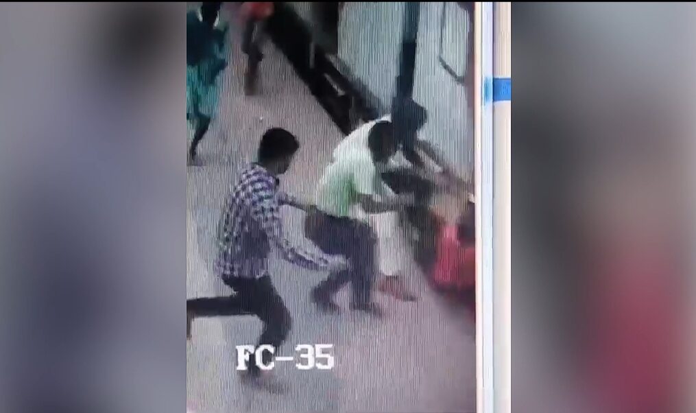 Passenger slips while trying to board moving train in eastern India, cop comes to rescue