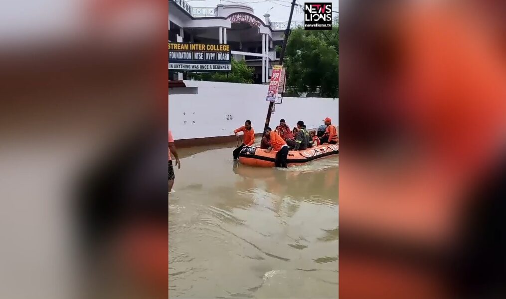 Fire officials come to rescue of people trapped in flooded houses in northern India