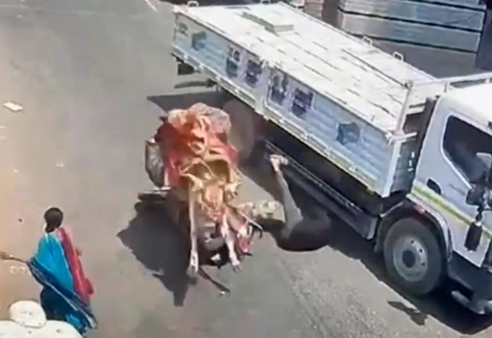 Bull attacks scooter rider in middle of road in southern India