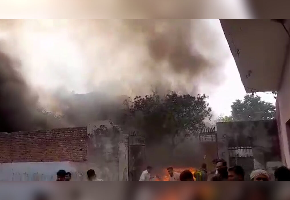 Fire officials comes to rescue after scrap warehouse catches fire in northern India