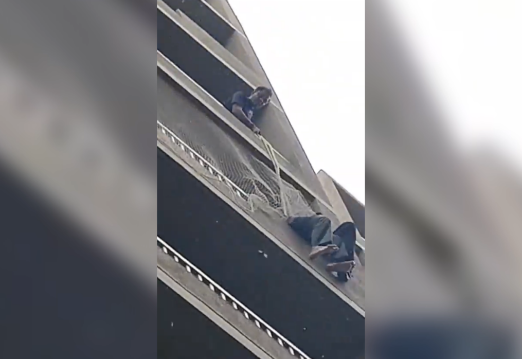 Officials rescue woman jumping from balcony in western India