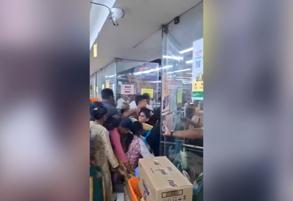 Smell of smoke sparks sudden panic inside showroom, forcing visitors to flee through narrow exit